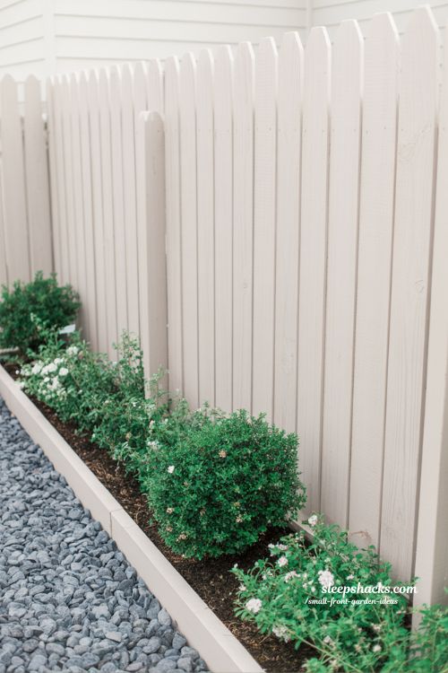 small front garden painted fence with green contrast landscaping clean modern cozy outdoor design 