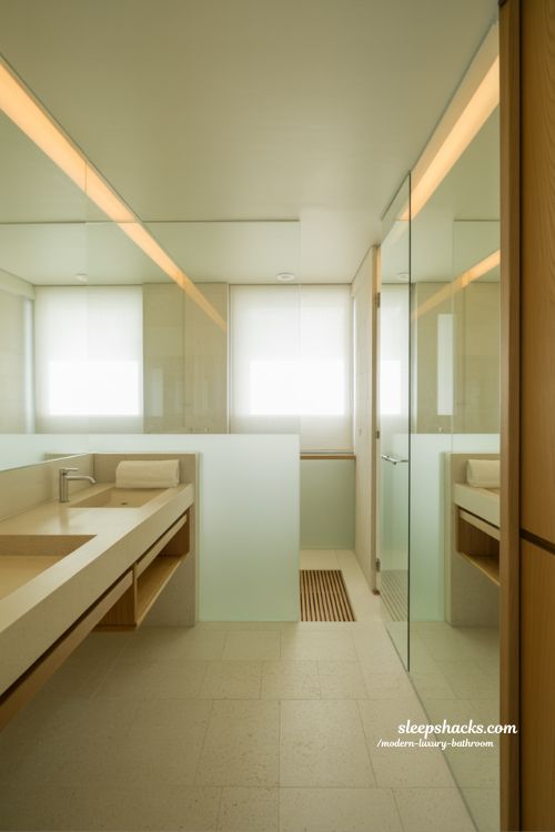 small modern luxury bathroom design with floating vanity glass shower and mirror for spacious spa like feel 