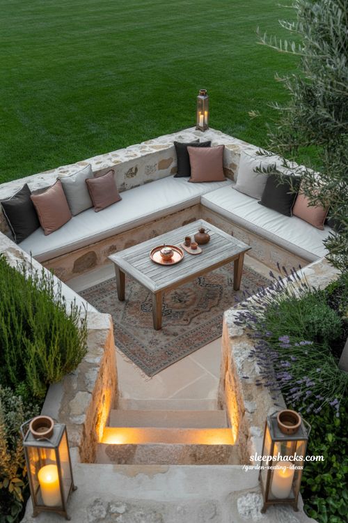 sunken garden seating area ideas with stone walls and warm lighting for a private outdoor lounge retreat