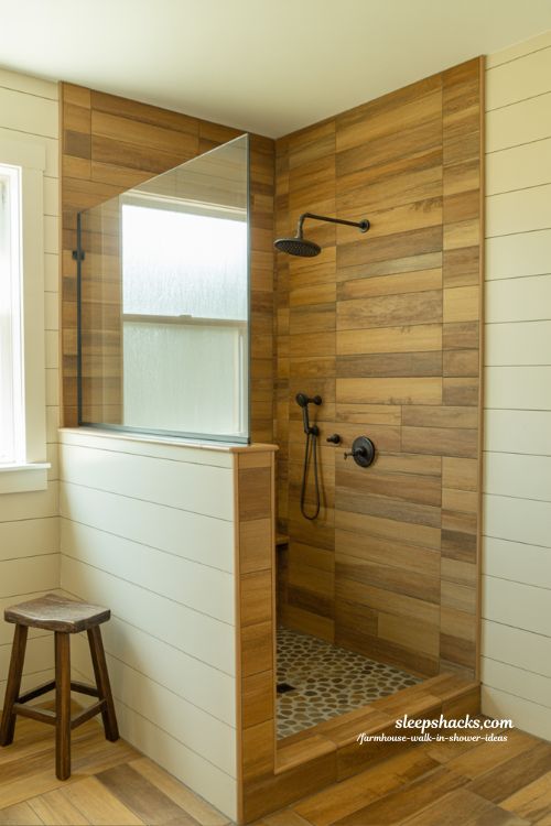 wood look ceramic tile farmhouse walk in shower with natural timber texture and pebble floor bathroom design