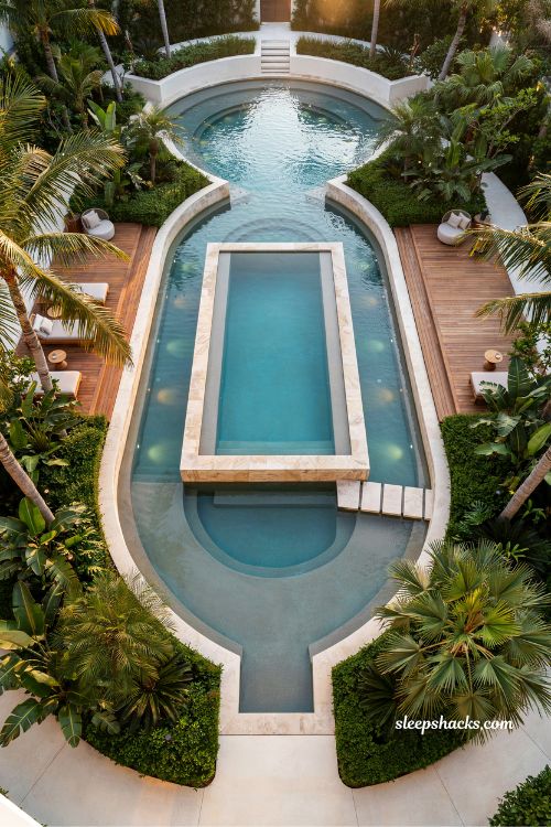 Backyard lazy river wrapping around main pool luxury resort style design ideas