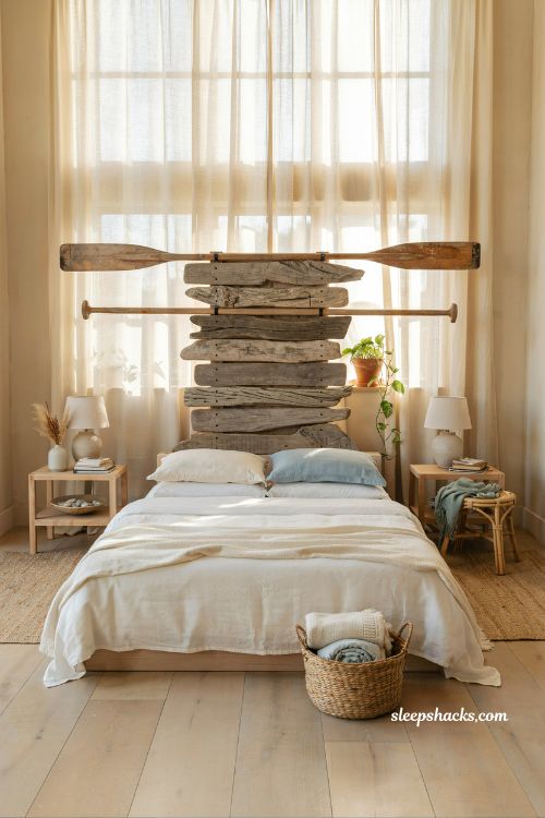 Beach room aesthetic bedroom with driftwood or oar headboard as coastal guest room focal point