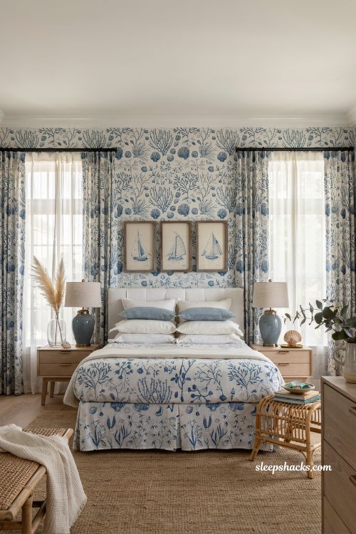 Beach room aesthetic bedroom with matching blue and white pattern walls drapes and bed skirt for a boutique coastal look