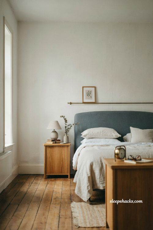 Blue and white bedroom ideas with blue upholstered bed and soft neutral minimalist decor