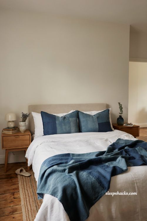Blue and white bedroom ideas with indigo dyed textiles and cozy handmade layered bedding