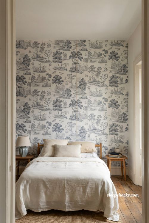 Blue and white bedroom ideas with patterned wallpaper and elegant statement wall design