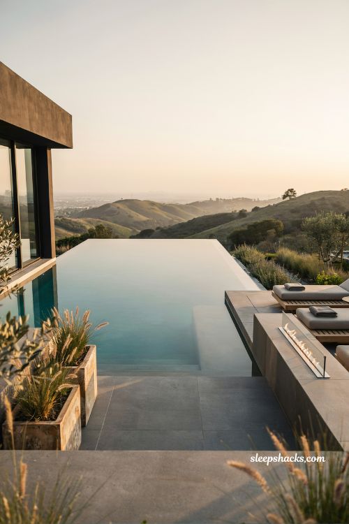 Clean rectangular pool design with modern limestone decking and timeless backyard style