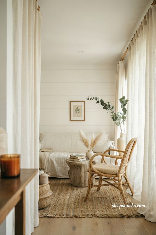 Coastal cottage living room ideas with linen curtains and soft natural filtered light