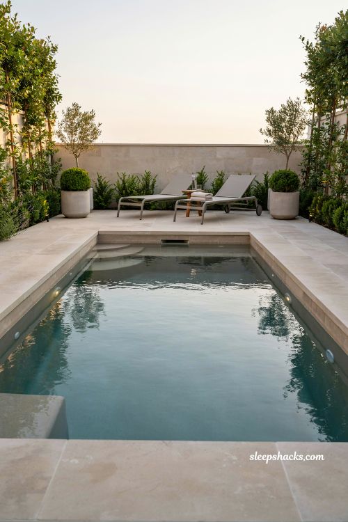 Cocktail pool small backyard spool design modern inground compact luxury pool for couples with minimalist spa style and warm stone patio