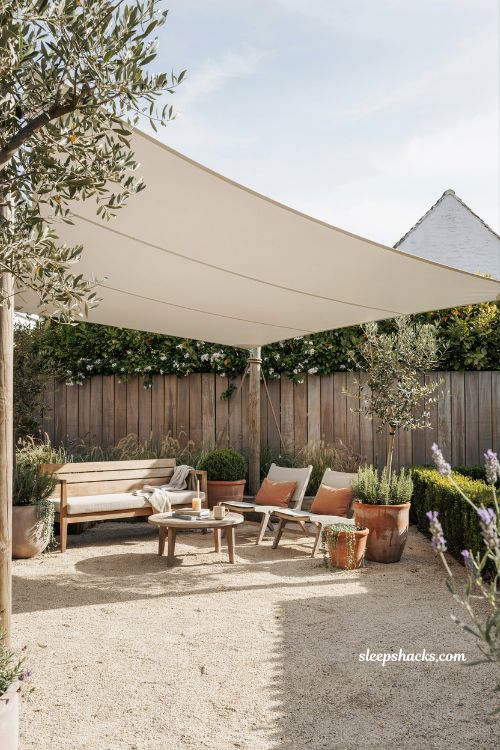Diy sail shade patio idea with wooden posts and modern outdoor sun shade design