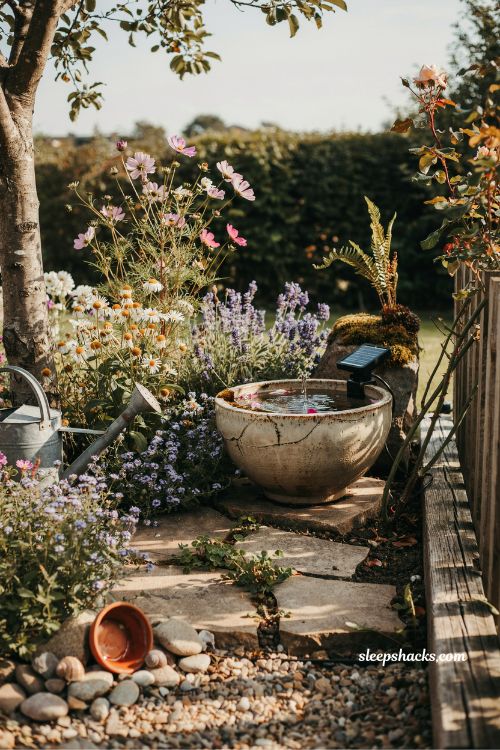 Diy solar water fountain idea with rustic garden bowl and solar pump