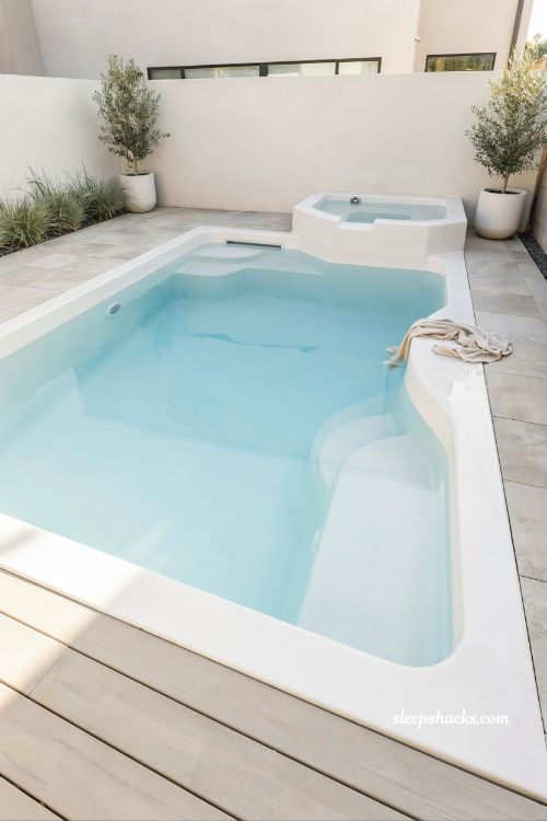 Fiberglass inground pool modern backyard design with tanning ledge and spa fast installation low maintenance luxury outdoor living