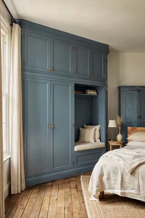 French blue bedroom ideas with custom cabinetry built ins and brass accented French country design