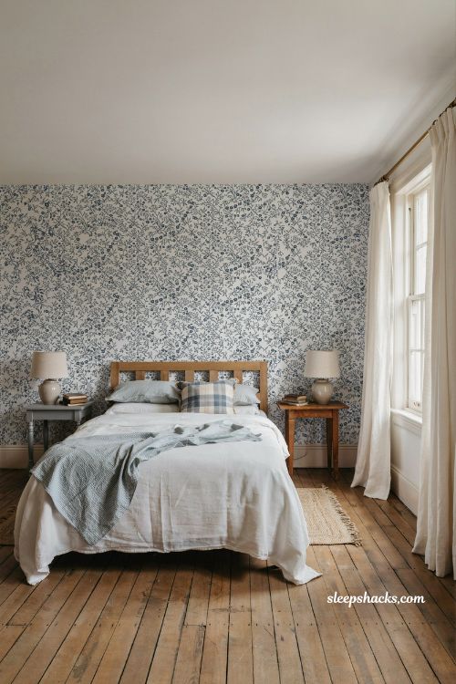French blue bedroom ideas with floral wallpaper and striped bedding layered French country pattern mix