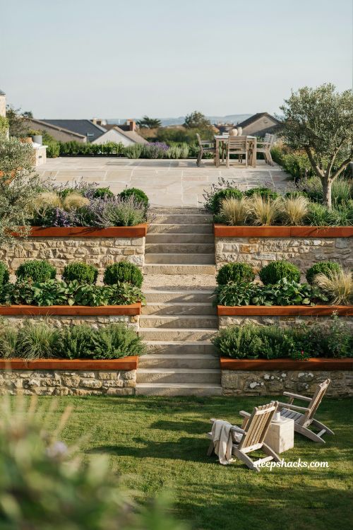 Garden landscape design ideas with terraced sloped backyard retaining walls and multi level outdoor garden structure