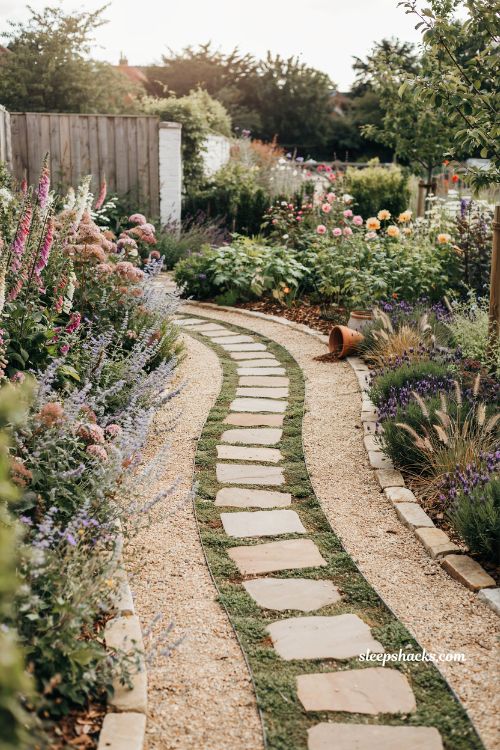 Garden landscape design ideas with winding stone path and layered planting walkway inspiration