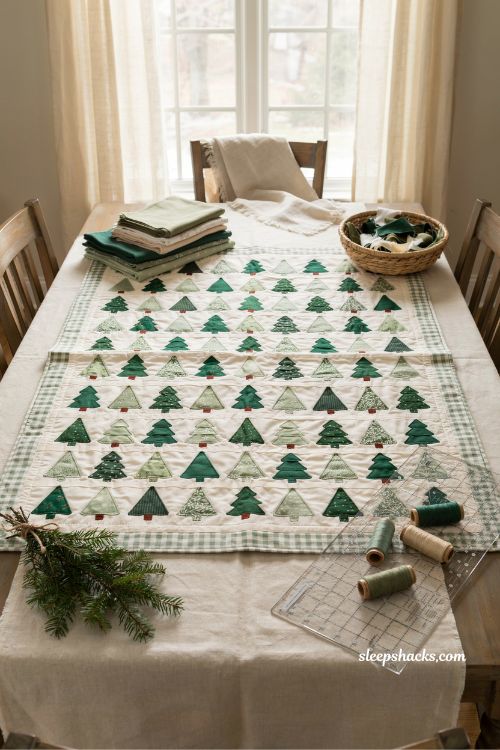 Holiday forest Christmas quilt with rows of evergreen trees and farmhouse style