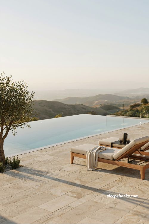 Infinity pool overlooking scenic landscape with vanishing edge design blending water into the horizon creating a seamless luxury outdoor view