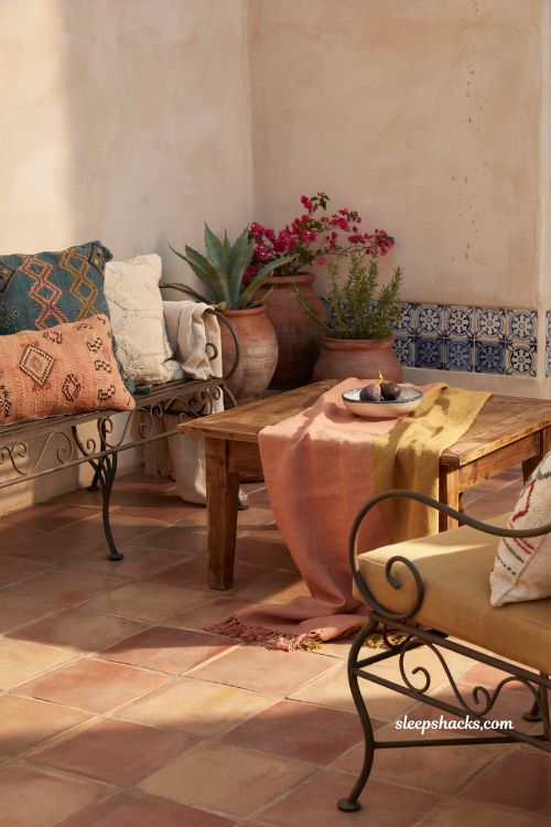 Mexican hacienda patio ideas with bold colorful textiles cushions and woven outdoor decor