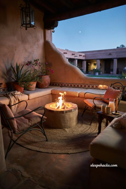 Mexican hacienda patio ideas with fire pit gathering corner rustic outdoor seating and warm evening ambiance
