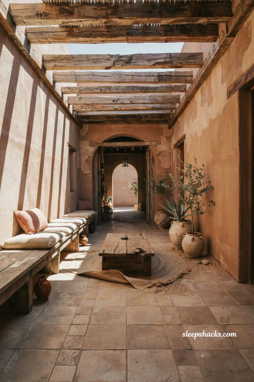 Mexican hacienda patio ideas with reclaimed wood furniture rustic beams salvaged timber courtyard design weathered farmhouse outdoor space warm natural textures