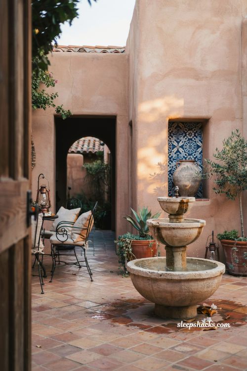 Mexican hacienda patio ideas with small stone fountain and tranquil courtyard water feature