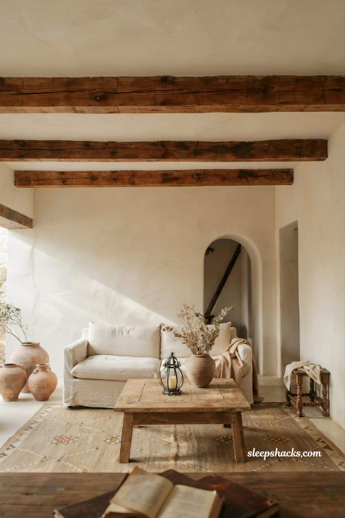 Mexican home decor ideas exposed wood beam ceilings rustic hacienda living room white plaster walls warm architectural interior design