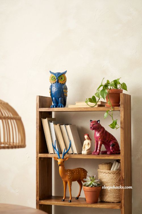 Mexican home decor ideas folk art alebrijes colorful wooden animal sculptures bookshelf decor Oaxacan artisan style interior