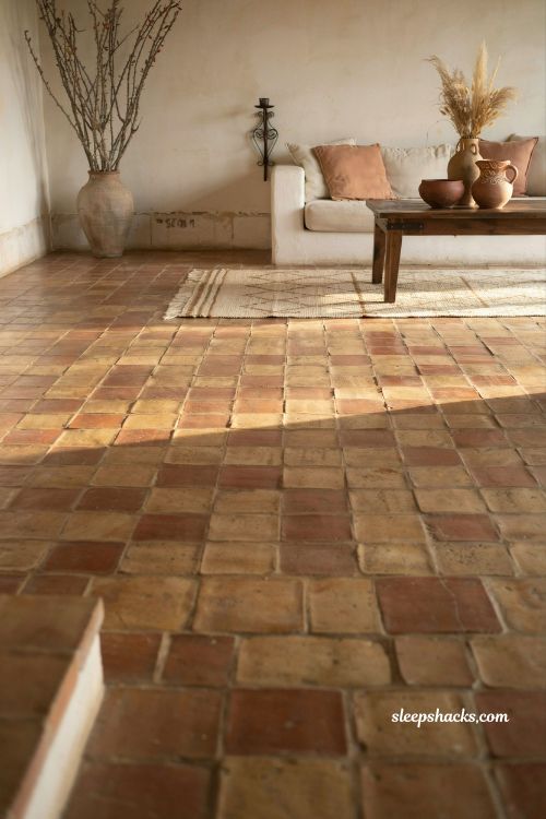 Mexican home decor ideas saltillo terracotta floor tiles rustic hacienda living room with woven rug and wood accents