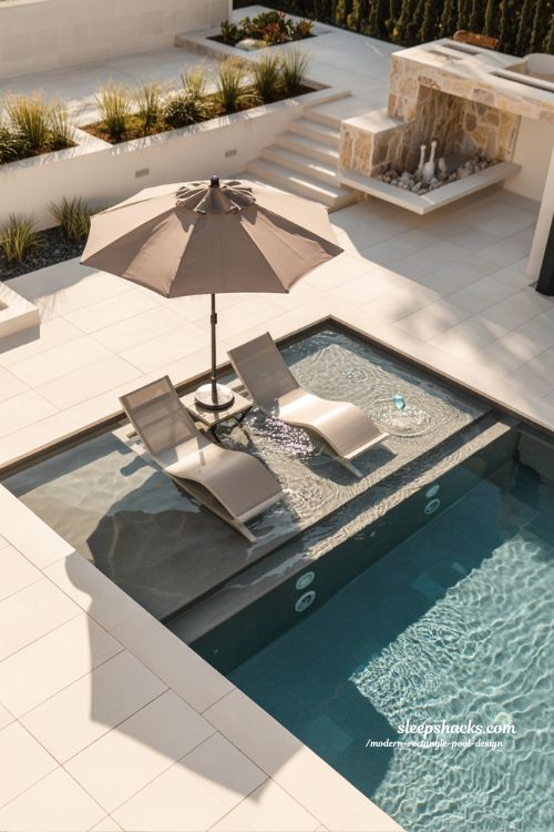 Modern rectangle pool with tanning ledge Baja shelf and in pool loungers design ideas