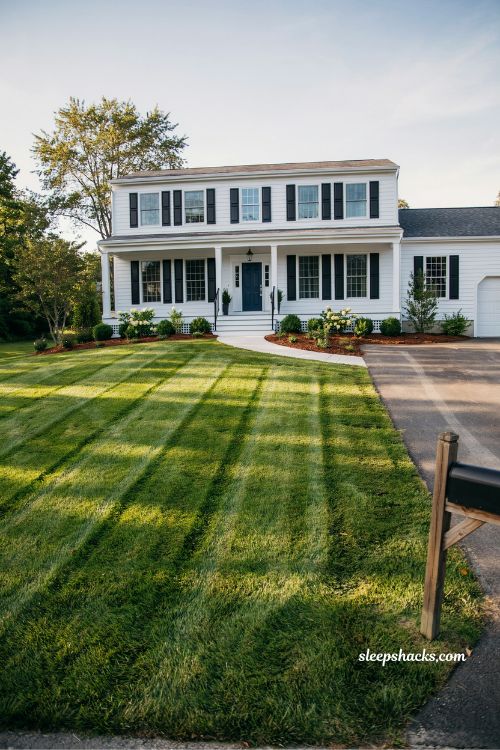 Mowing stripes into the lawn for a clean professional front yard look