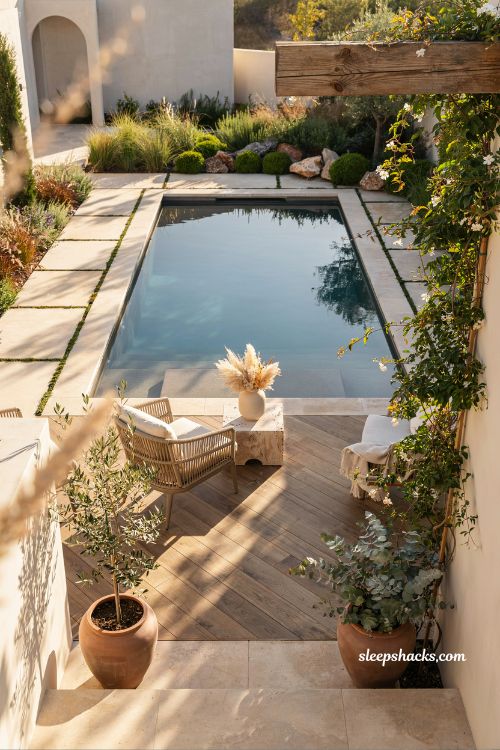 Natural stone and timber pool decking design with organic modern backyard landscaping