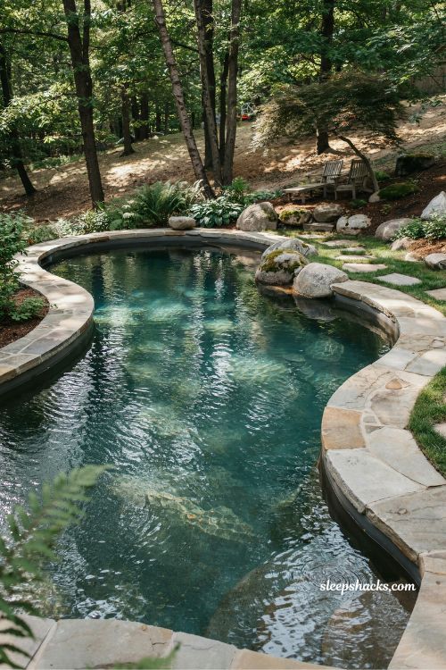Natural stone freeform pool design with organic shape and landscape integration