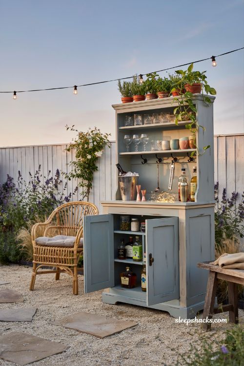 Outdoor bar idea from repurposed vintage hutch backyard entertaining station