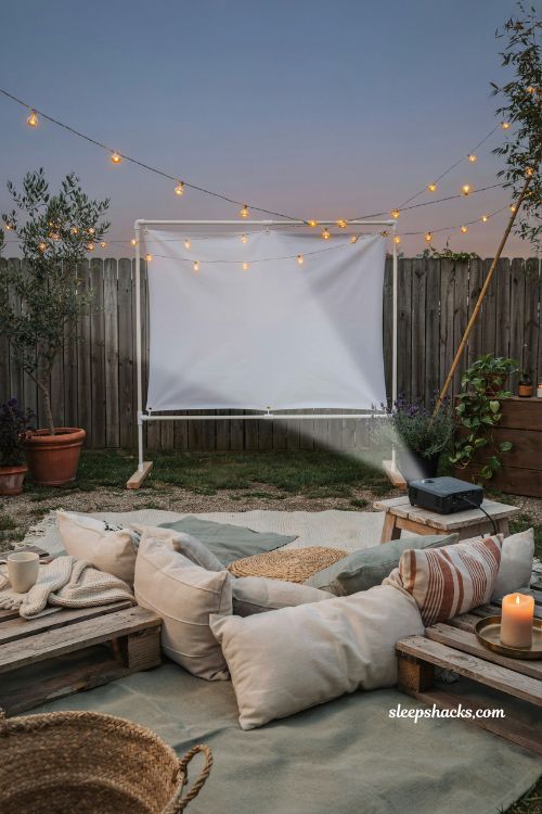 Outdoor movie theater diy backyard setup with projector and cozy seating ideas
