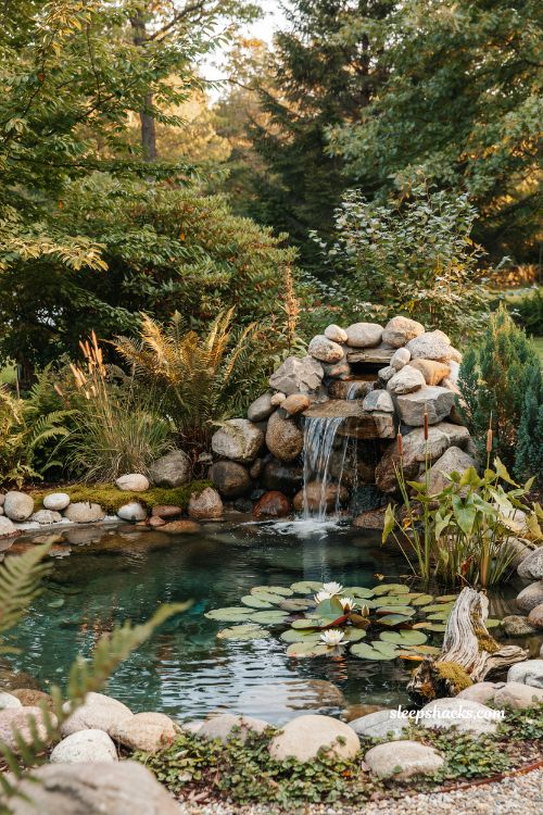 Oval in ground mini pond ideas with a natural flagstone surround 
