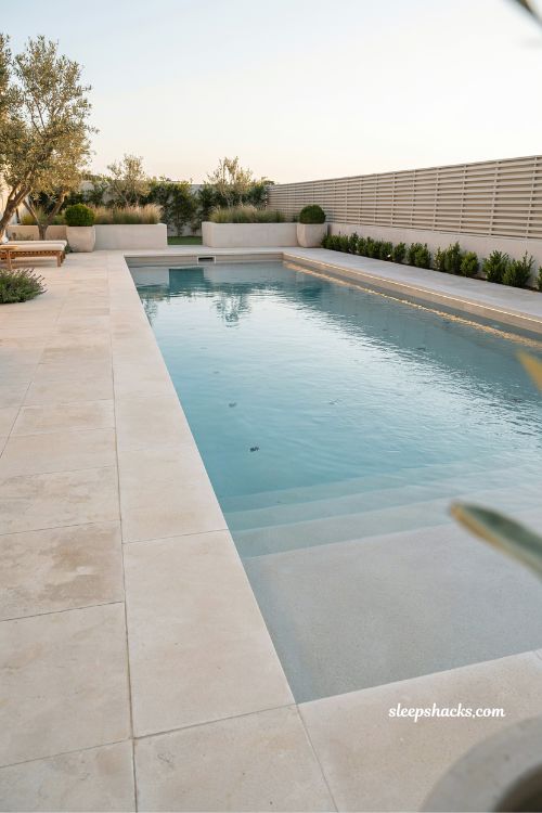 Rectangular pool with jumping wall along lap lane design idea