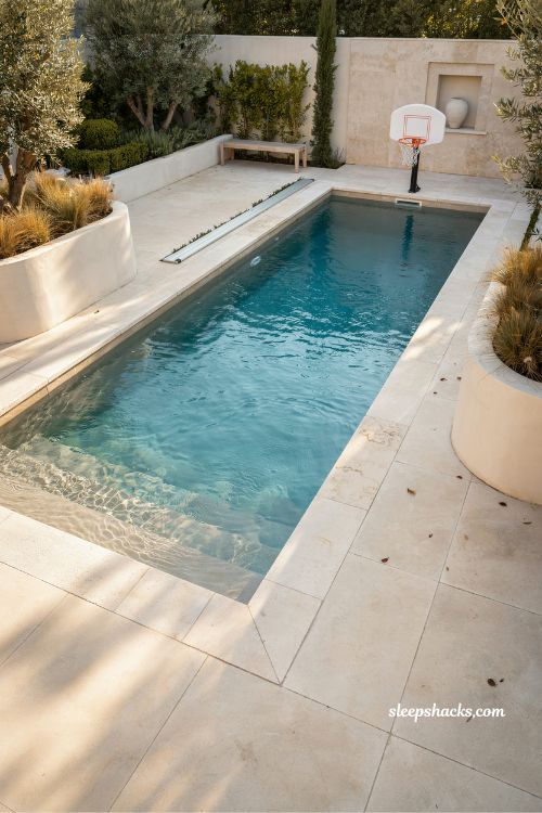 Rectangular pool with small basketball hoop near deep end design idea
