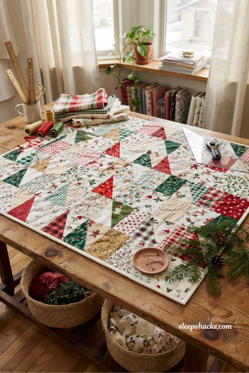 Scrappy triangle Christmas quilt made with vintage prints and festive stash fabrics