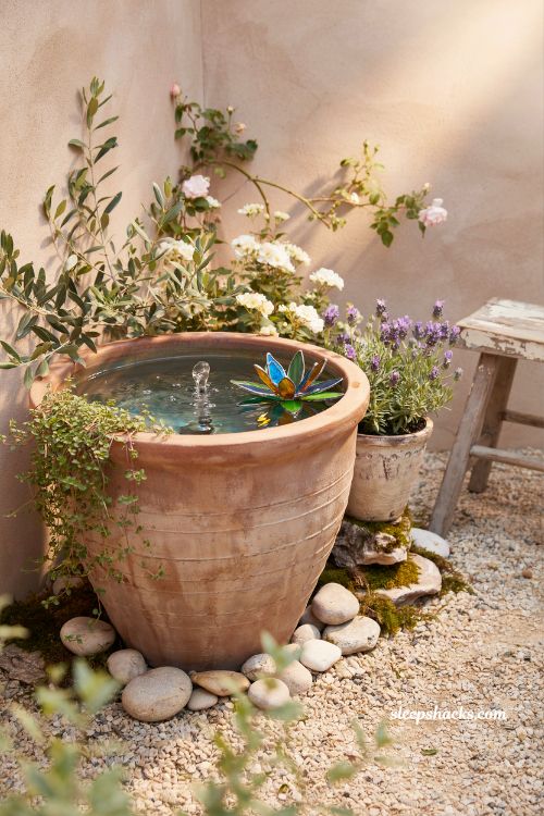 Simple clay pot mini pond ideas with a bubbling patio water feature 