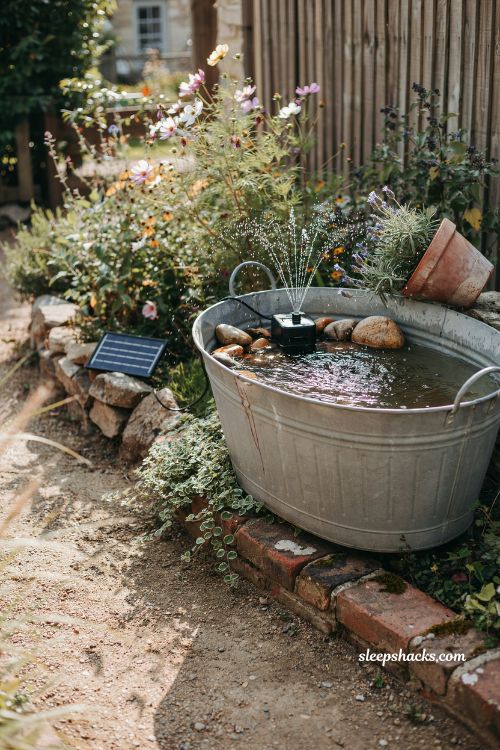 Simple floating solar pump fountain in a galvanized steel tub garden