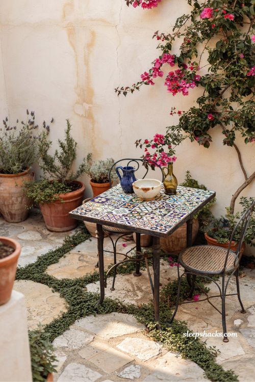 PROMPT: Small mediterranean garden ideas with a potted meyer lemon tree full of fruit and blossoms in a sunlit courtyard (1)