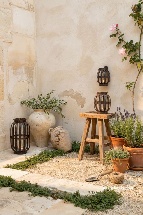 Small mediterranean garden ideas with a privacy hedge and climbing trellis creating a secluded courtyard nook 