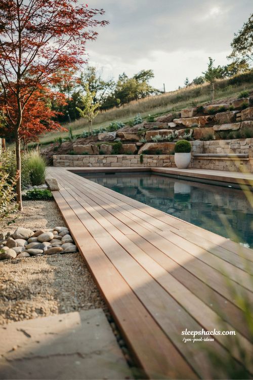Small sloped backyard ideas with floating deck and zen pool water edge design