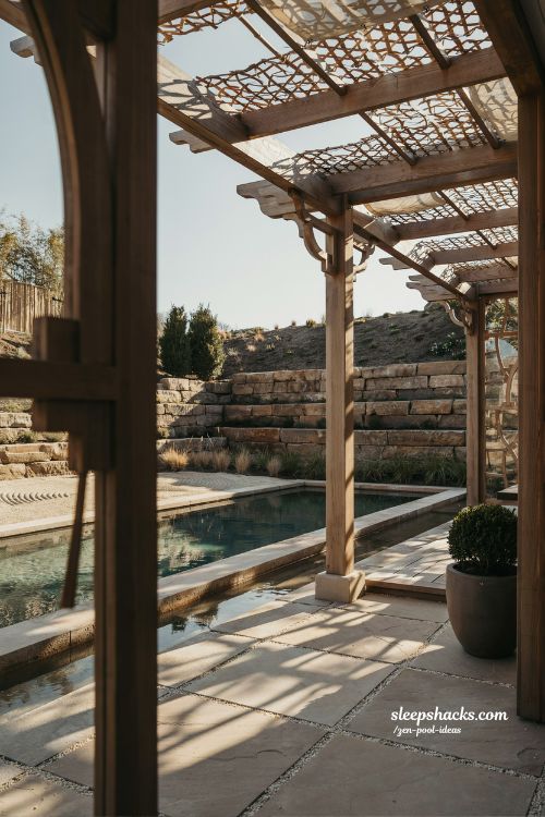 Small sloped backyard ideas with shaded pergola and zen pool patio design