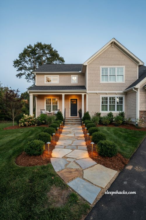 Solar stake lights along the front path for warm and welcoming night curb appeal
