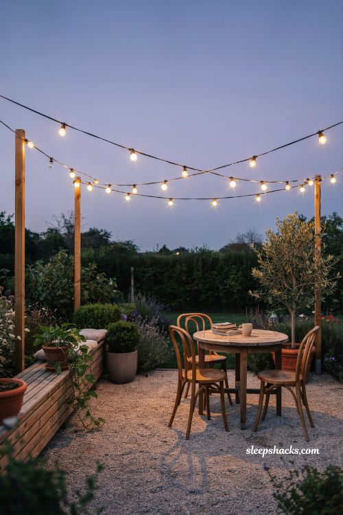 String lights patio setup diy with wooden posts and cozy backyard lighting ideas