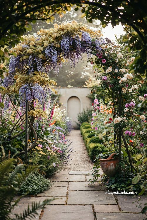 Whimsical backyard ideas with garden arch covered in vines and romantic cottage garden entrance pathway
