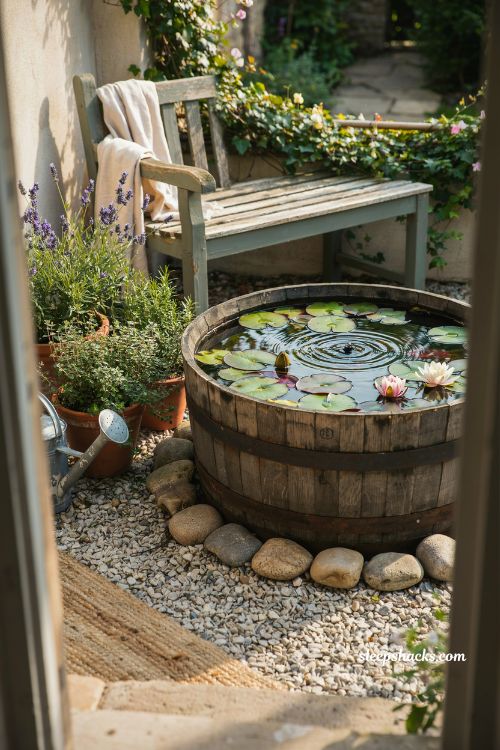 Whiskey barrel container pond idea for a cozy patio water garden