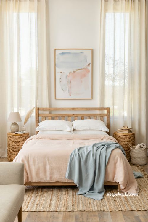 blush bedding coastal bedroom idea with soft pink and blue tones for a light airy seaside feel